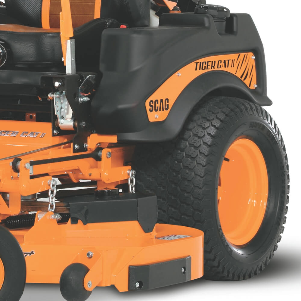 Close-up of an orange and black SCAG Tiger Cat II lawn mower on a white background